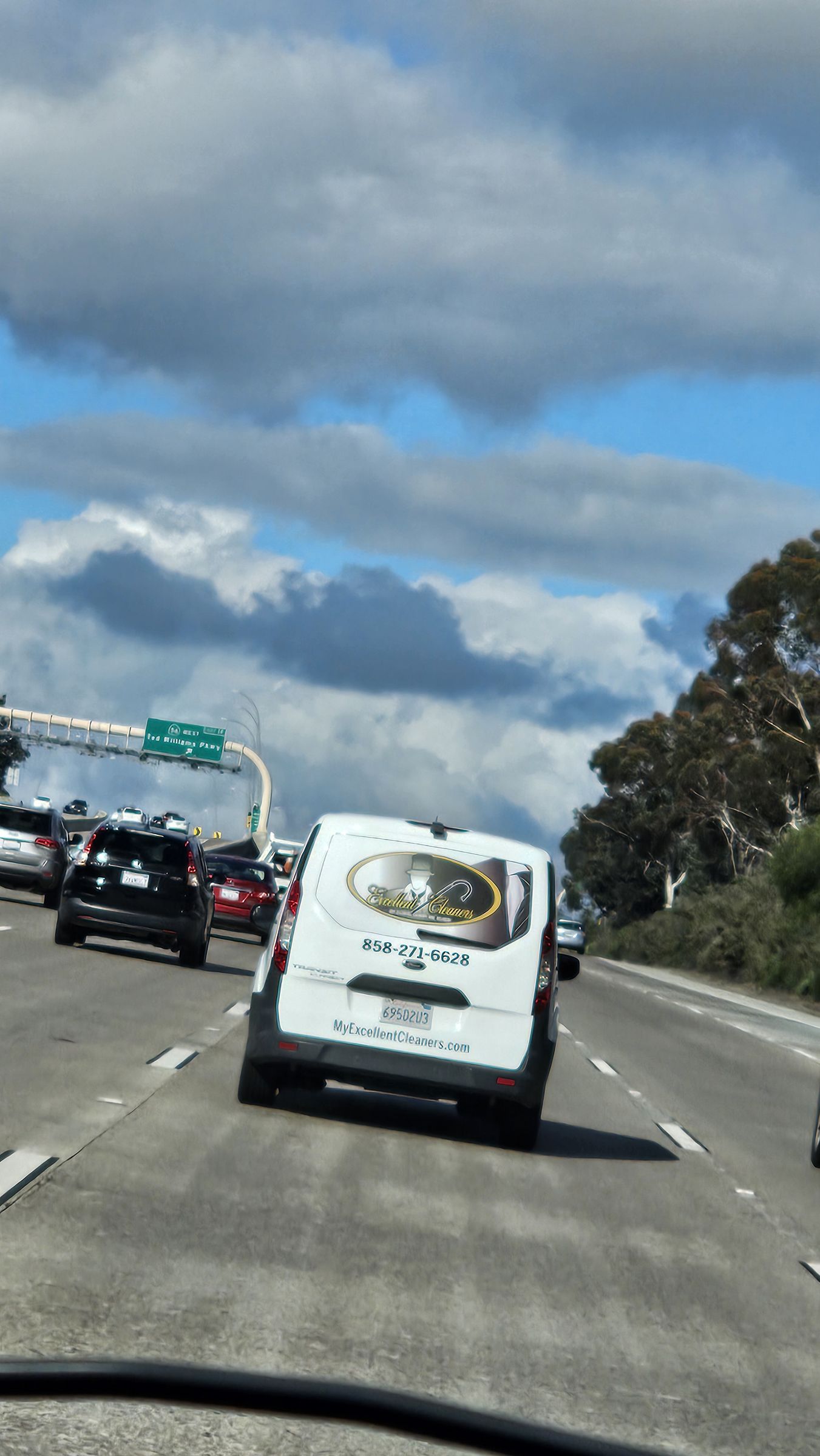 Excellent Cleaners delivery van on the freeway